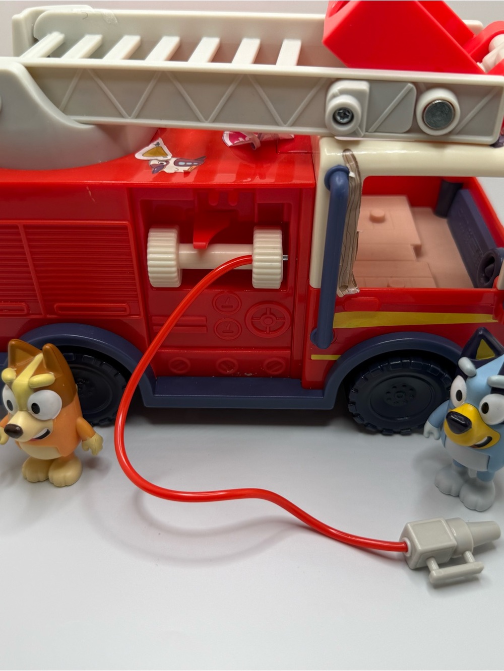 Disney Bluey fire truck playset toy with bingo bluey figure